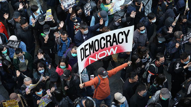 Hundreds of thousands take to streets of Hong Kong