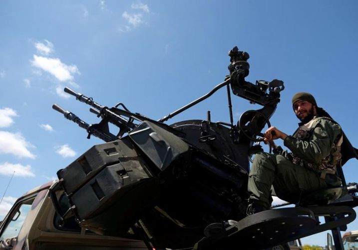 Libyan commander urges forces to advance toward central Tripoli