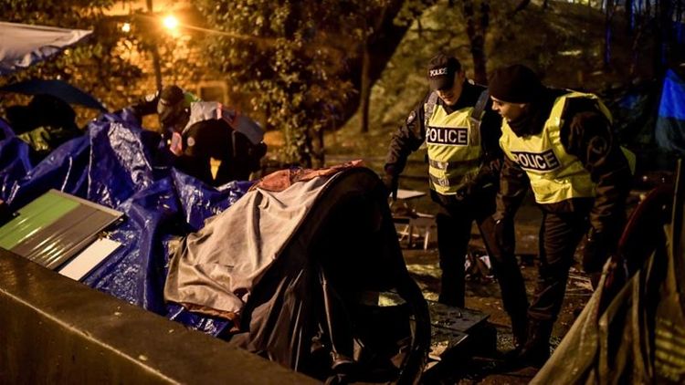 French police evacuate migrants from northern Paris site