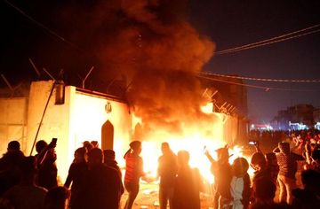 Iraq protesters torch Iran consulate in Najaf, curfew imposed