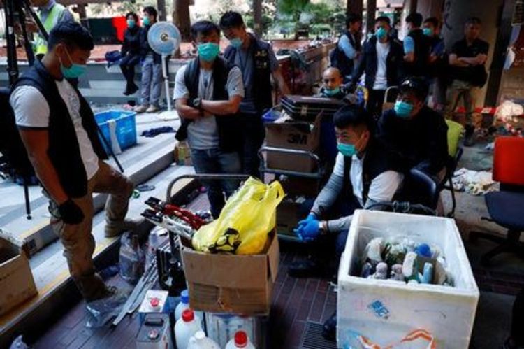 Hong Kong protesters call for weekend rallies, police quit campus battleground
