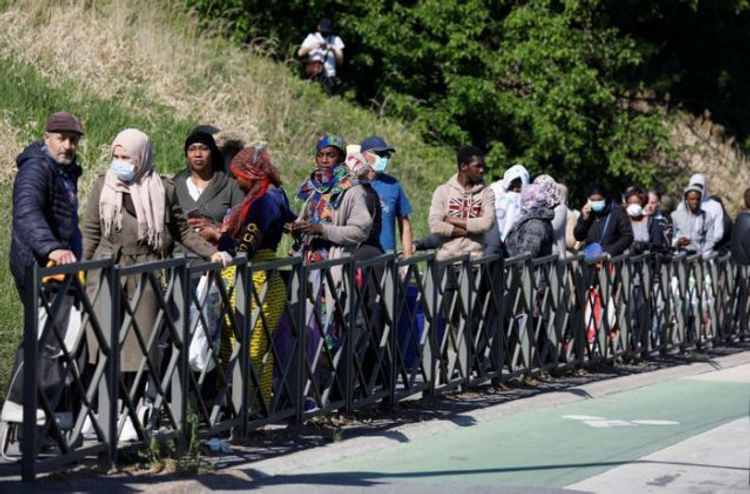 On the margins of Paris, the food bank queues grow longer