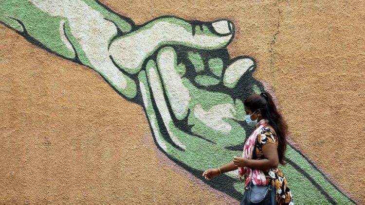 India reports 60,963 new virus cases, 834 deaths