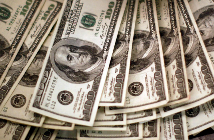 Dollar edges higher from 27-month lows as investors await Fed minutes