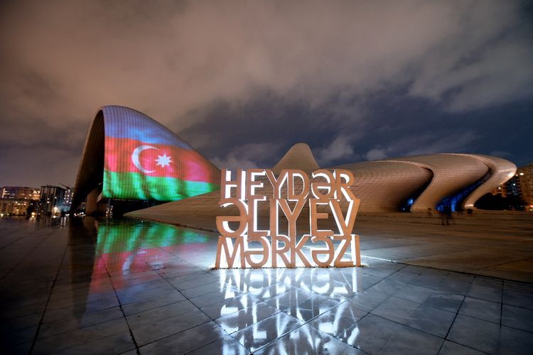 Heydar Aliyev Center, Flame Towers and Baku Olympic Stadium illuminated with Azerbaijani flag  - PHOTO