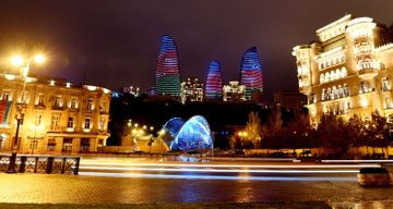 Heydar Aliyev Center, Flame Towers and Baku Olympic Stadium illuminated with Azerbaijani flag  - PHOTO