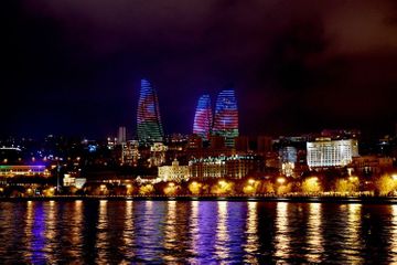 Heydar Aliyev Center, Flame Towers and Baku Olympic Stadium illuminated with Azerbaijani flag  - PHOTO