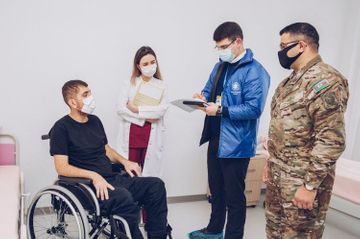 YASHAT Fund representatives meet with wounded servicemen and families of martyrs