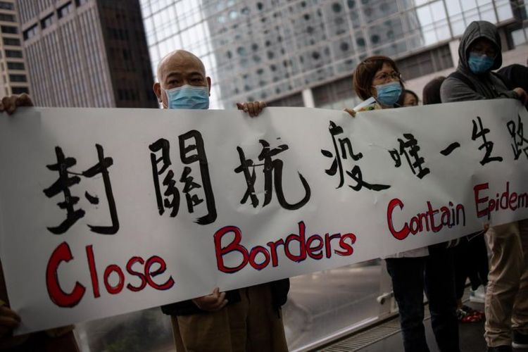 Hong Kong suspends 10 border checkpoints with mainland China in bid to curb virus