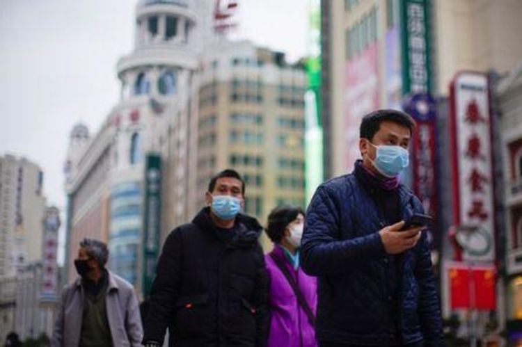 China reports fall in coronavirus cases, says economy resilient, but infections rising elsewhere