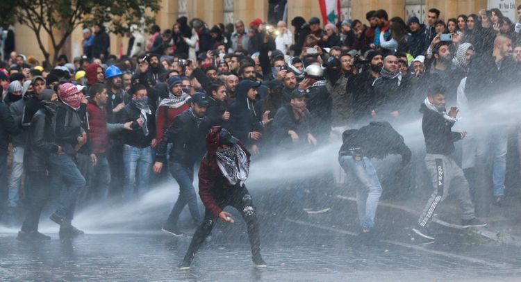 Lebanese police fire tear gas as clashes with protesters resume in Beirut's centre