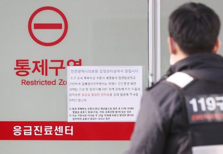 As virus spreads to more Chinese cities, WHO calls emergency meeting