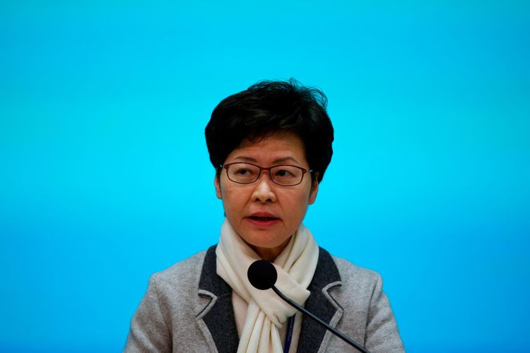 Hong Kong leader declares virus emergency, halts official visits to mainland China