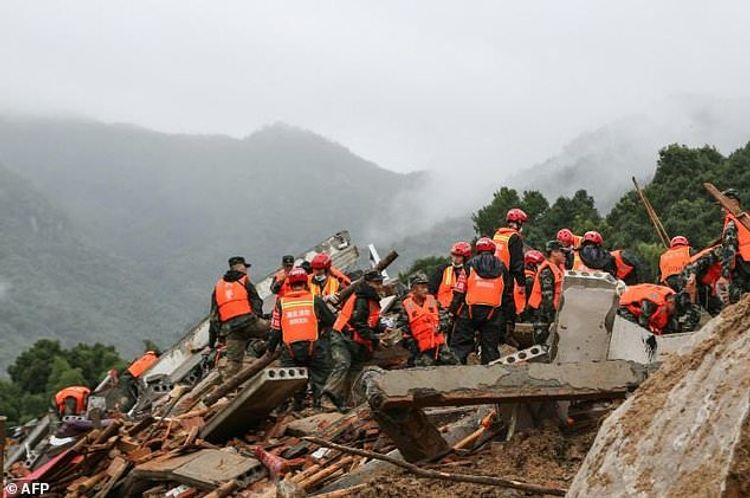 China landslides leave at least 14 dead or missing