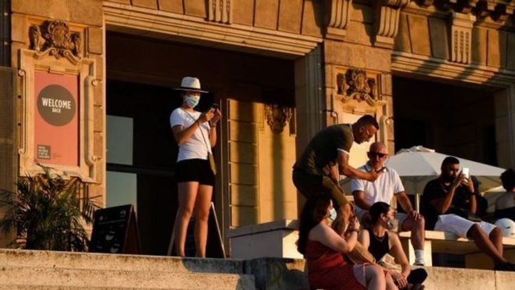 Spain insists it is safe amid new virus outbreaks