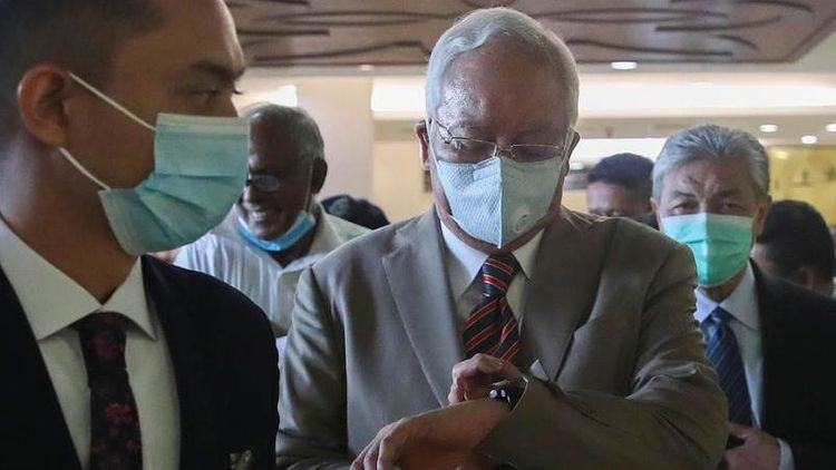 Ex-Malaysian PM sentenced to 12 years in jail