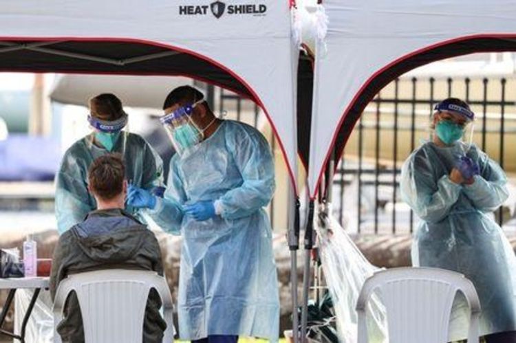 Australia reports record spike in coronavirus cases, 13 deaths