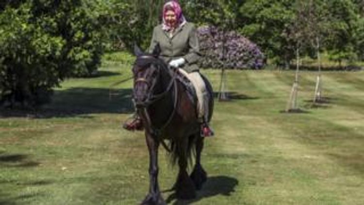 Queen Elizabeth back in the saddle as British lockdown eases