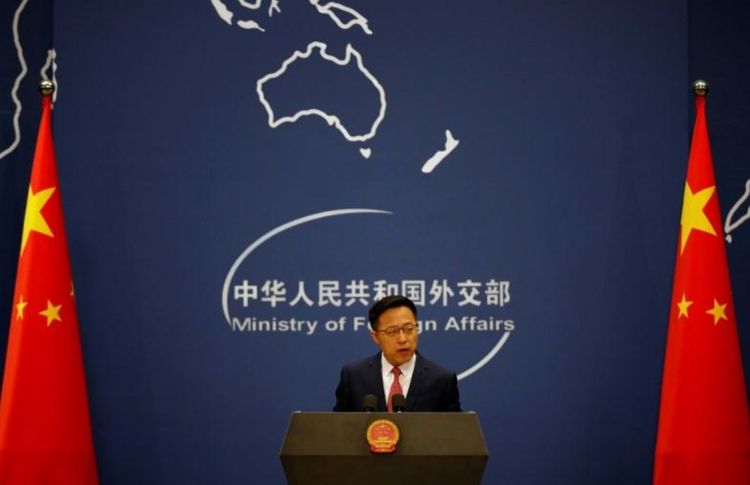 China says U.S. 'addicted to quitting' over plan to withdraw from WHO