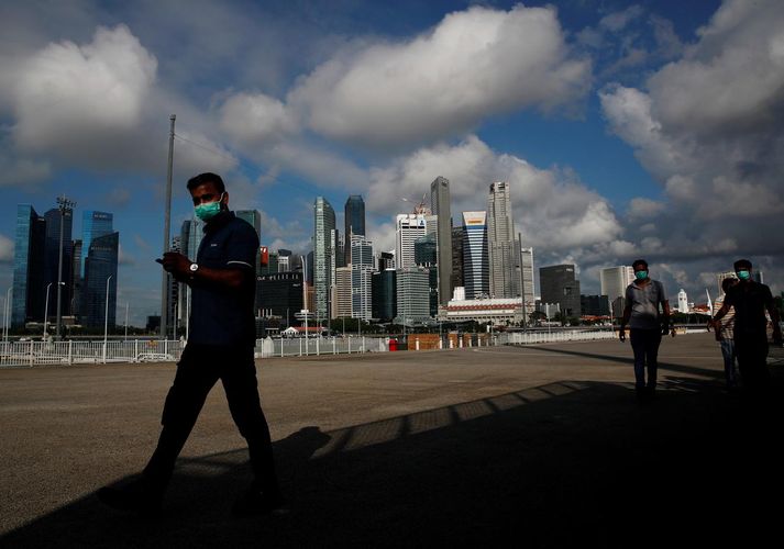 Singapore to remove most coronavirus restrictions from Friday