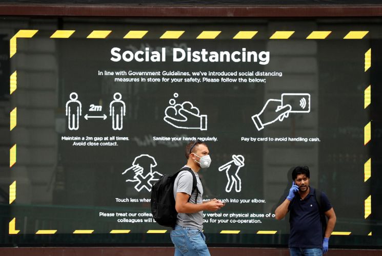 UK COVID-19 death toll hits 53,077 including suspected cases