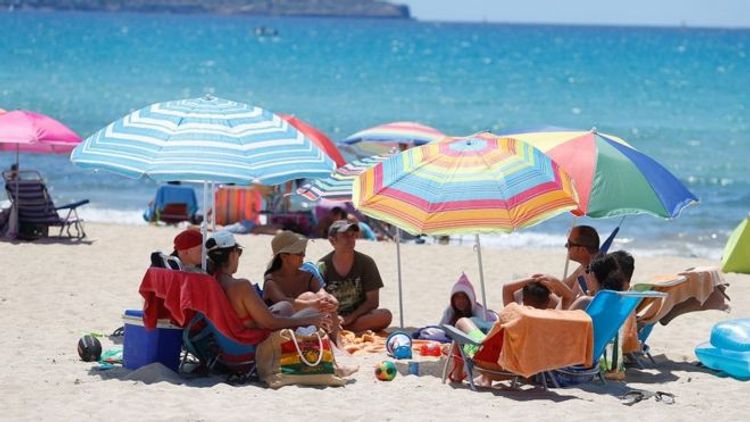 Spain welcomes tourists back as emergency ends