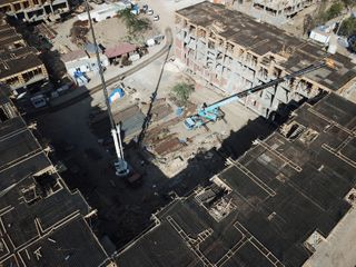 President Ilham Aliyev views construction of residential complex by MIDA in Ganja
