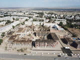 President Ilham Aliyev views construction of residential complex by MIDA in Ganja
