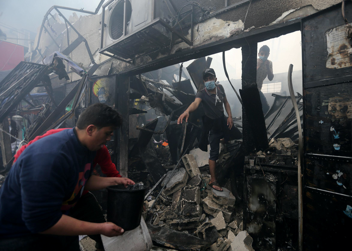 Ten killed in Gaza after bakery fire sweeps through packed market