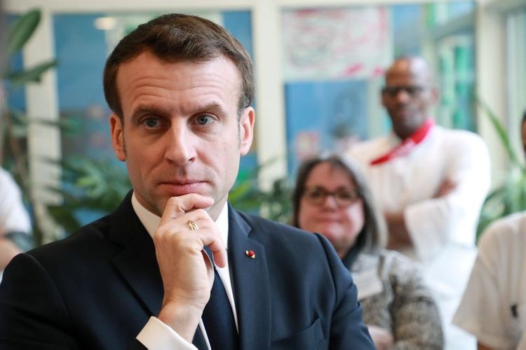 France's Macron urges tight limits on retirement home visits over virus worries