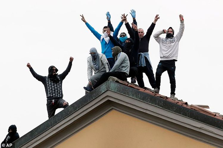 Six inmates are killed in Italy after setting fire to their prison in anger at a coronavirus-prevention ban on family visits - as similar protests spread through jails across the country