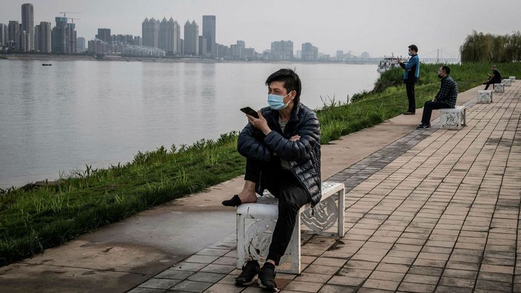 China adds 4 new virus cases with no symptoms