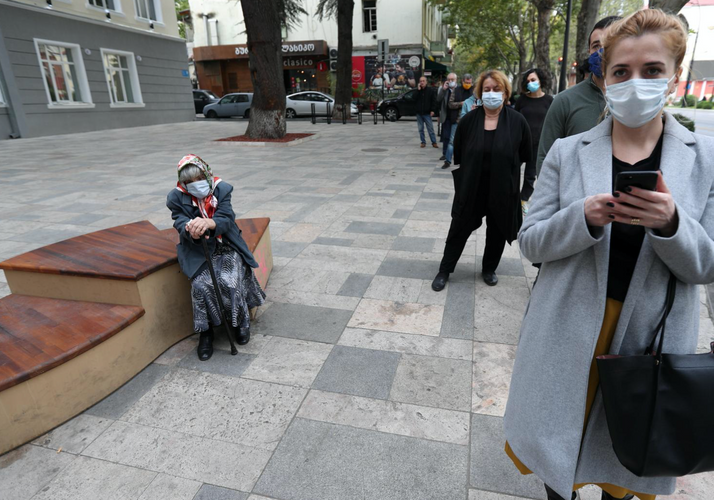 Ruling party in ex-Soviet Georgia leads in parliament vote, opposition protests