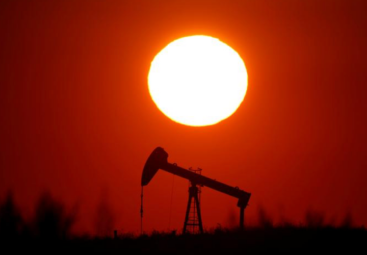 Oil prices slip as surging COVID-19 cases overshadow vaccine hopes