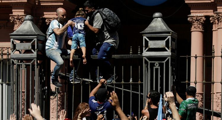 Maradona's funeral ceremony suspended as hundreds of people try to access government palace