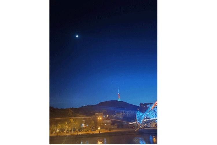 Tbilisi television tower is illuminated with colors of Azerbaijani flag