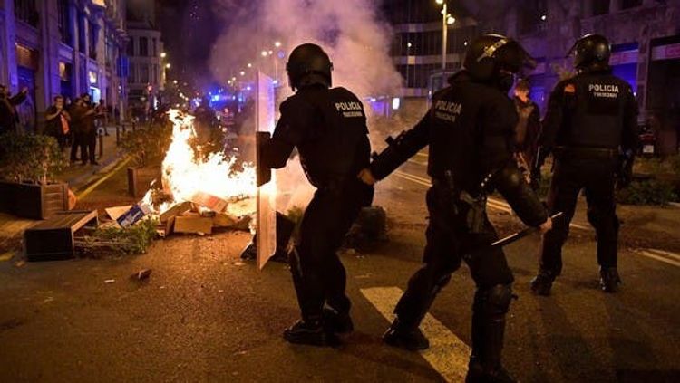 Protesters clash with police over COVID-19 restrictions in Barcelona