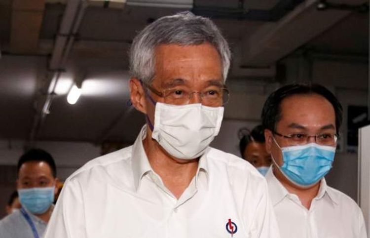 Singapore PM admits faults in handling of migrant dorms