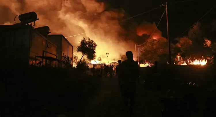 Greek Prime Minister calls emergency meeting after massive fire in migrant camp