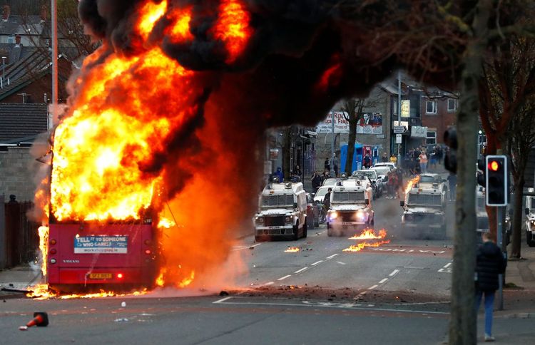 UK PM urges calm as Belfast protesters hijack bus, attack police