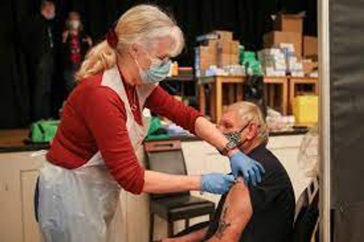 Britain offers all over-50s first COVID-19 shots, beats target