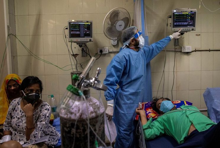 India's daily COVID-19 cases rise by record 273,810