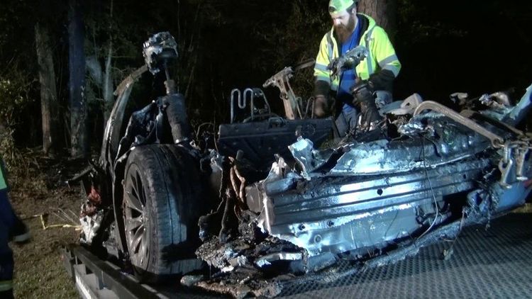 Two men killed in Tesla car crash 'without driver' in seat