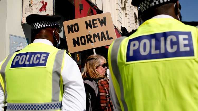 Eight police officers injured as anti-lockdown protests turn violent in London