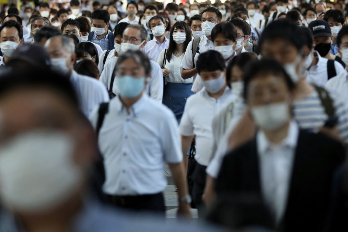 Japan to hospitalise only most serious COVID-19 cases in surge
