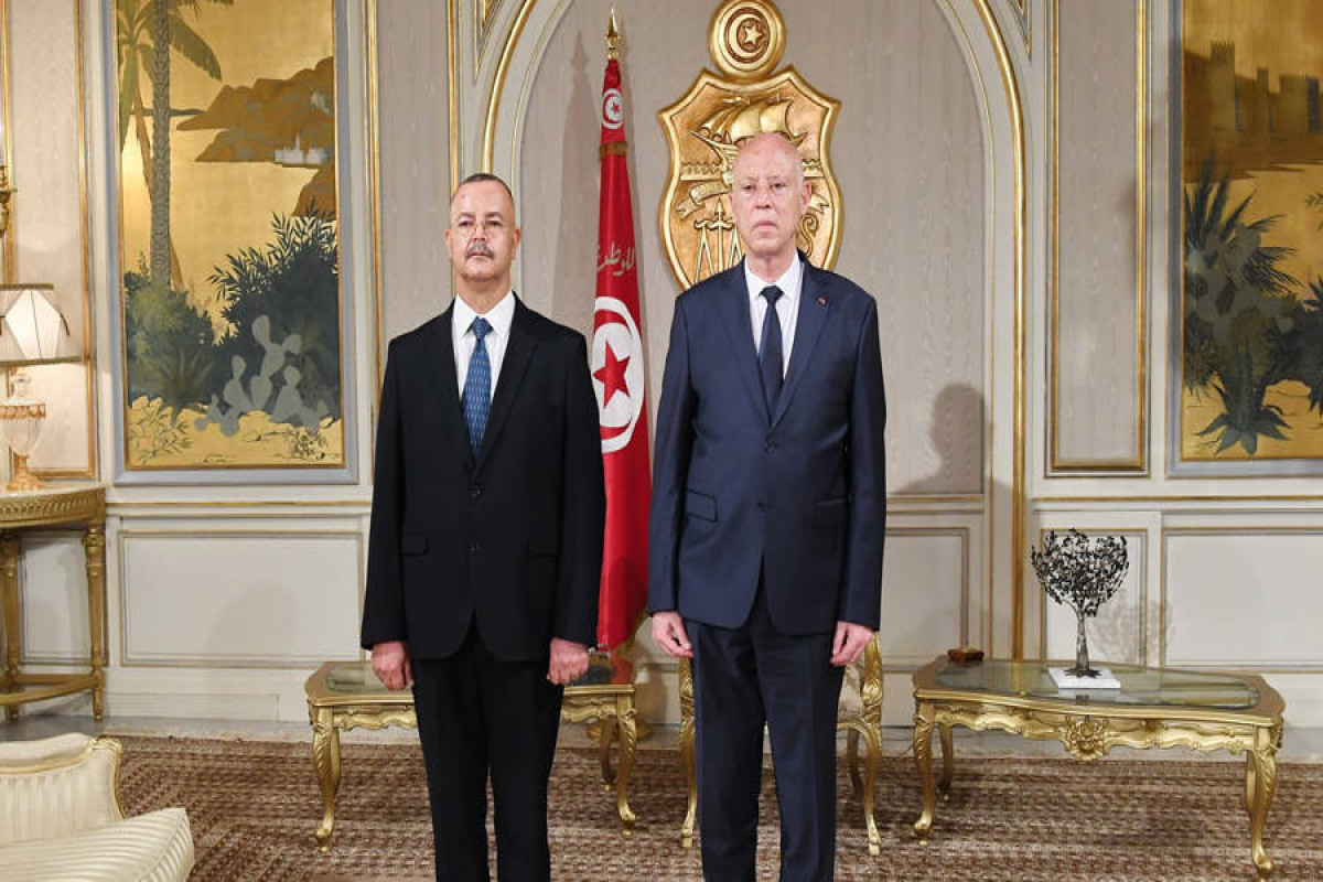 Tunisian President Kais Saied and newly appointed health minister Ali Mrabet