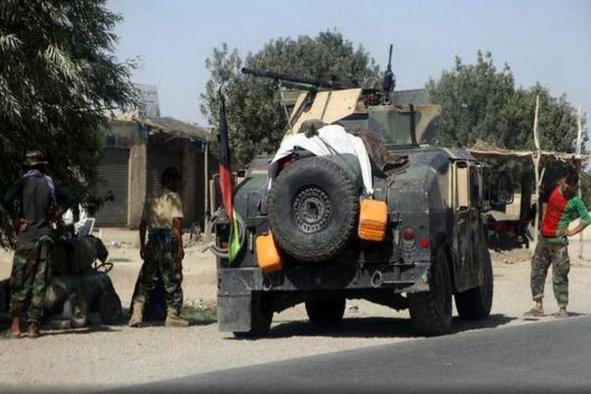 Afghan security personnel patrol on the outskirts of Mazar-e-Sharif, northern Afghanistan