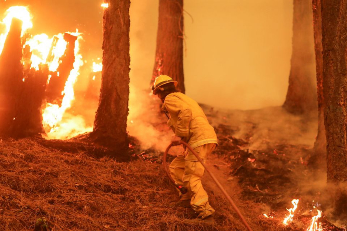 Crews battling California's mammoth Dixie fire brace for high winds