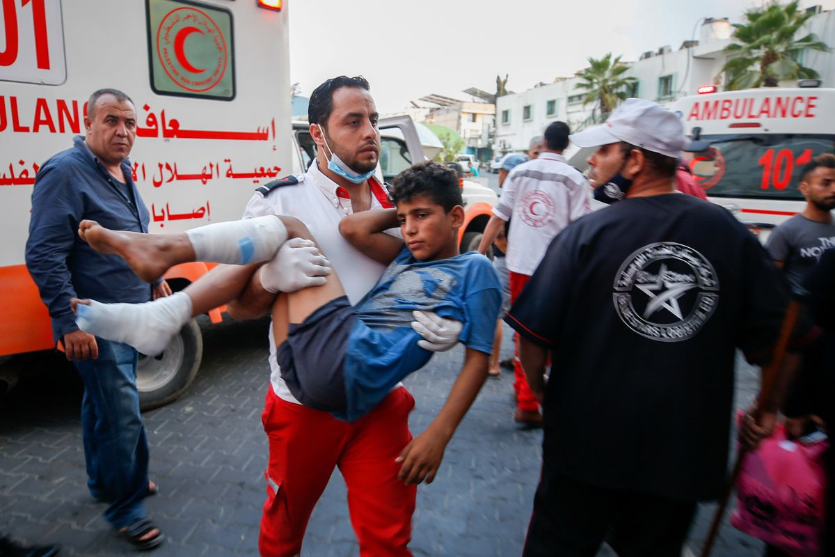 Two Palestinians, Israeli soldier seriously injured in Gaza crossfire