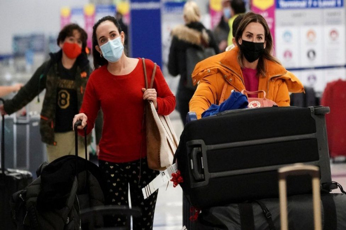 Omicron prompts cancelled flights and new curbs